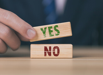 The wooden block shows yes or no letters.	
