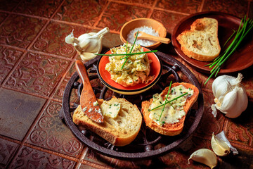 Homemade garlic bread or baguette slices with garlic butter and herbs