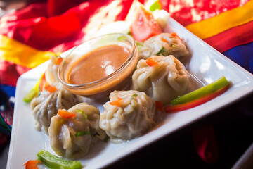 Momo are bite-size dumplings made with a spoonful of stuffing wrapped in dough with origins from...