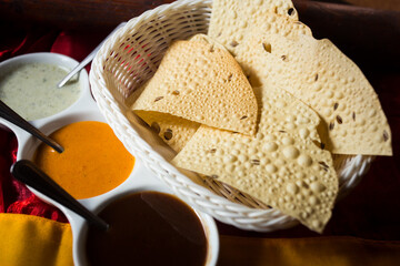 Papadam is a flat, thin bread that is typical of the cuisine of the Indian subcontinent. It is...