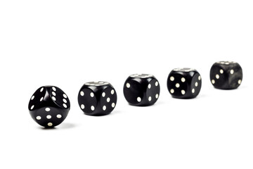 Five black dice for playing poker on a white background