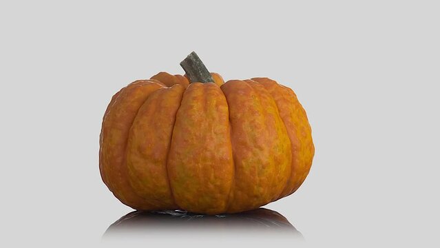 Rotating orange pumpkin isolated on white background