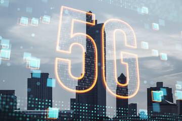 Creative glowing 5g hologram on blurry city background. 5G network concept, high speed mobile internet, new generation networks. Mixed media. Double exposure.