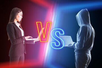 Hacker with laptop versus businesswoman on blurry dark neon background. Competition, battle and...