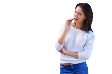 An attractive young woman standing and biting on a pen isolated on a PNG background.