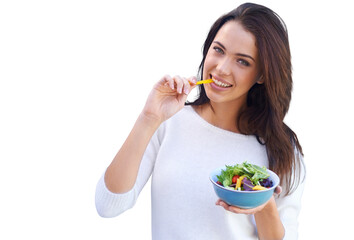 An attractive young woman standing and eating a bowl of salad isolated on a PNG background.