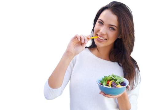An attractive young woman standing and eating a bowl of salad isolated on a PNG background. - Powered by Adobe