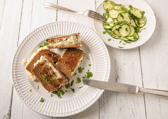 Grilled feta cheese sandwich with rye bread and zucchini salad. Healthy summer meal