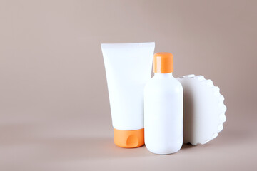 Packaging for cream and liquids. Two white bottles for cosmetics. The bottles are white, without labels. A place for text and stickers. Plastic bottles.Skin care products.Copy space.