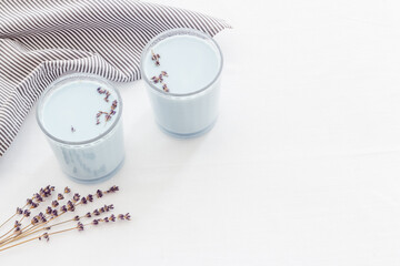 Obraz na płótnie Canvas Blue matcha latte in glass with lavender. Cold drink