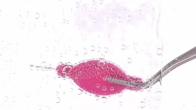 Interdental brush in a sparkling water.