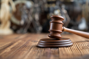 Law concept. Jugde’s gavel on rustic wooden desk.