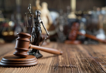 Law concept. Jugde’s gavel on rustic wooden desk.