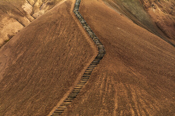 Walking trail stairs on the Kerlingarfjöll orange mountains in iceland