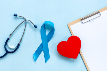 Awareness blue ribbon with red heart. Symbol of prostate cancer