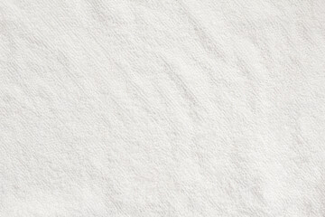 Fototapeta na wymiar Close-up of white pile fabric with fine irregularities seen from overhead angle