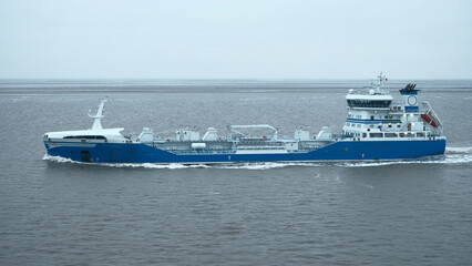 Elbe river, Germany - 01 20 2023: Side view of the handysize oil tanker front view