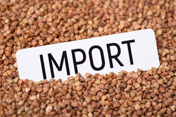 Paper with inscription Import on buckwheat. Trade of buckwheat grain between countries