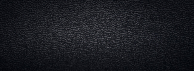 Texture of a fine black leather surface using as background or header
