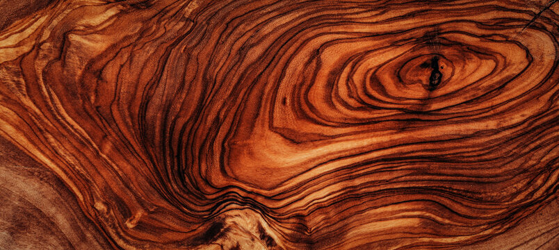texture of dark brown olive wood plank. background of wooden surface