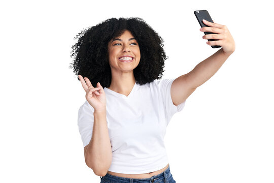 An attractive young woman using a smartphone to take selfies isolated on a PNG background.