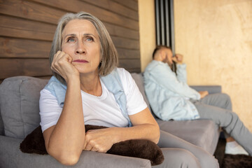 Fototapeta premium Couple looking upset and stressed after the argument
