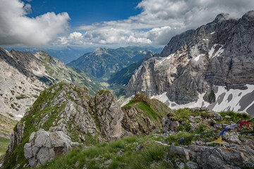 Fototapeta na wymiar Between Italy and Austria: on the top of mountain near Volaia Lake Raunchkofer Mountain (Lago di Volaia Monte). Mountain hiking Trail Road.