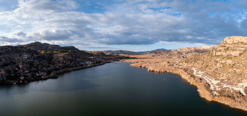 panorama landscape of the Elche Reservoir lake in Alicante Province in warm evening light