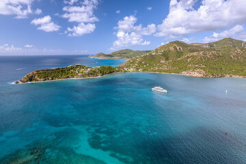 The drone aerial view of Deep Bay beach in Antigua Island.