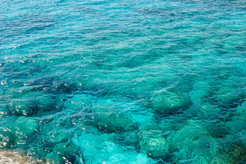 Fototapeta na wymiar Surface of turquoise and transparent Mediterranean Sea