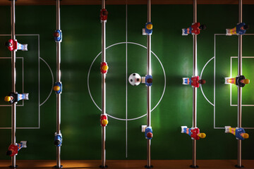 Table football game in progress creates a sense of excitement and competition