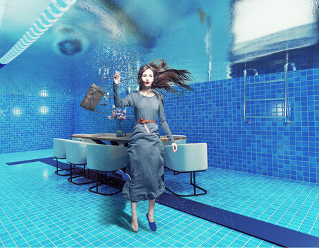 underwate living interior in the swiming pool and the woman