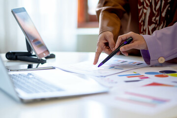 Businesswoman and partner hands holding pointing graph chart, Finance and Accounting.