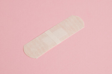 Flatlay, medical bactericidal patch on a pink background
