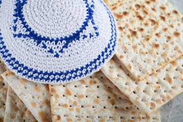 Passover celebration concept. Matzah, red kosher and walnut. Traditional ritual Jewish bread...