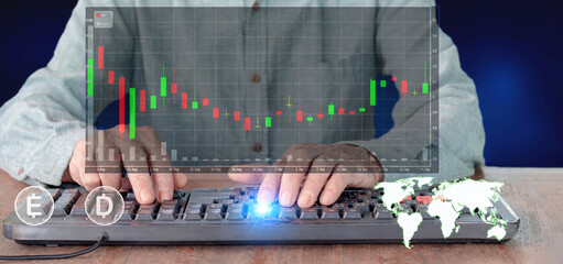 Male hands on computer keyboard and stock graph virtual screen