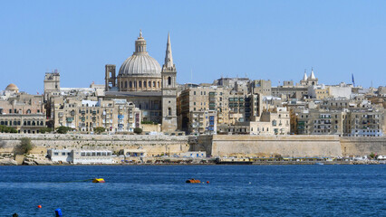 Fototapeta na wymiar the beautiful cupola of St John's Cathedral and the city of Valletta, the capital of Malta. Seen from Sliema