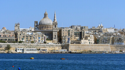 Fototapeta na wymiar the beautiful cupola of St John's Cathedral and the city of Valletta, the capital of Malta. Seen from Sliema