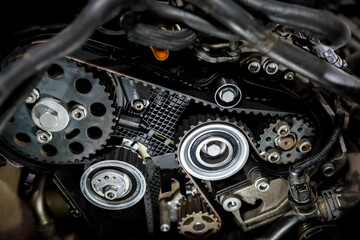 Fototapeta na wymiar Part of a car motor close-up. Engine repair at a service station