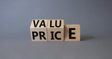 Value and Price symbol. Wooden cubes with words Price and Value. Beautiful grey background. Business and Value and Price concept. Copy space