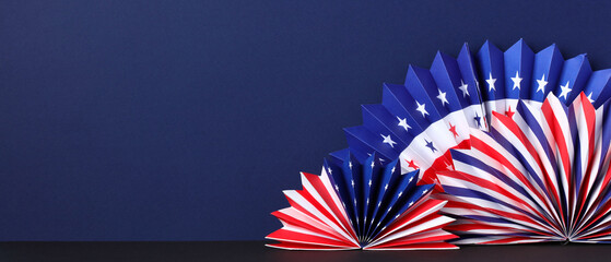 Presidents Day banner design with American Flag paper fans decorations on dark blue background.