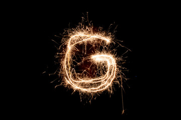 Different figures, letters or drawings created at night with flares; infinity symbol, a heart,...