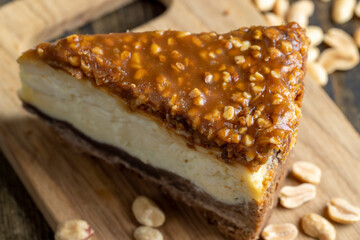 Cheesecake made of dairy products and peanuts in caramel