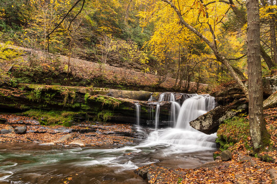 Found near the abandoned mining town of Thurmond, West Virginia is a hidden waterfall  named Dunloup Creek Falls. Here is it shown during Autumn. 
