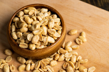 Peeled and roasted peanuts on the table