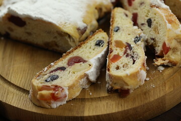 traditional stollen with decoration on wooden background