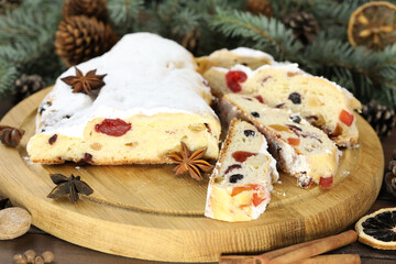 traditional stollen with decoration on wooden background