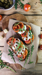 Bruschetta with tomato pesto and mozzarella - 564634797