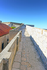 Walk on the ancient, defensive city wall in Dubrovnik, Croatia at the Dalmatian Coast of the Adriatic Sea
