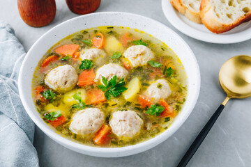 Meatballs soup. Chicken vegetables meatballs soup with carrots and potatoes.